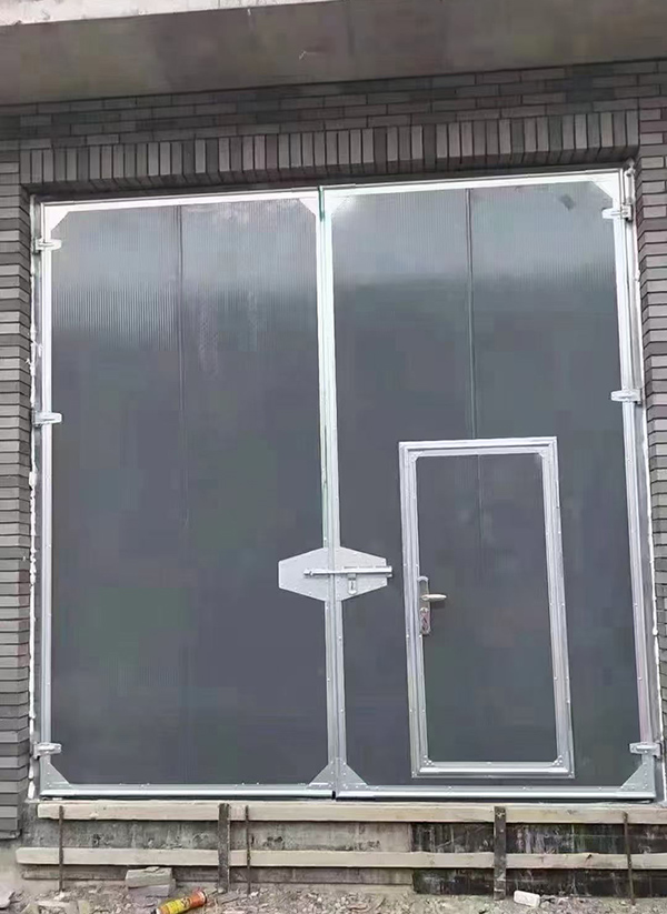 海南藏族工业平开门在大型设备制造车间的应用实例